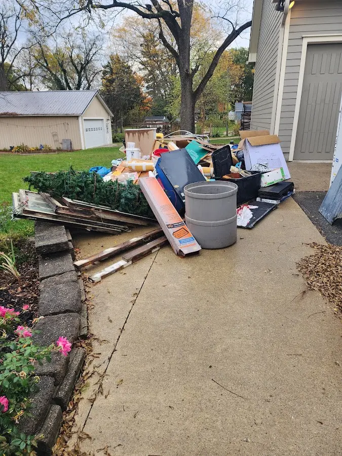 Dumpster being loaded with debris for Demolition Dumpster Rental in Lakeshore